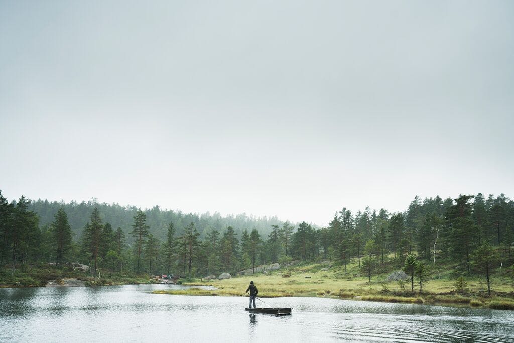 Sup boarding on a lake in norway