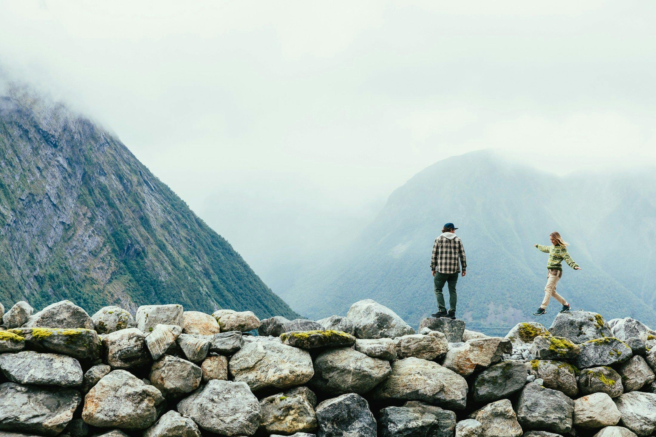 man and woman hiking in norway