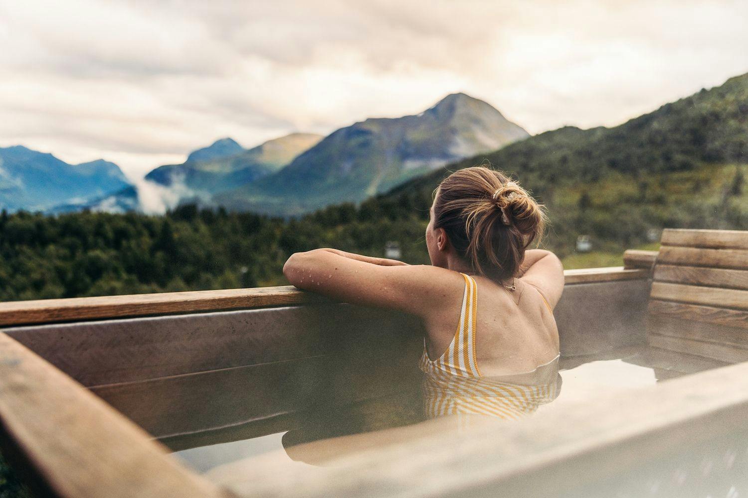 woman overlooking a norwegian mountain